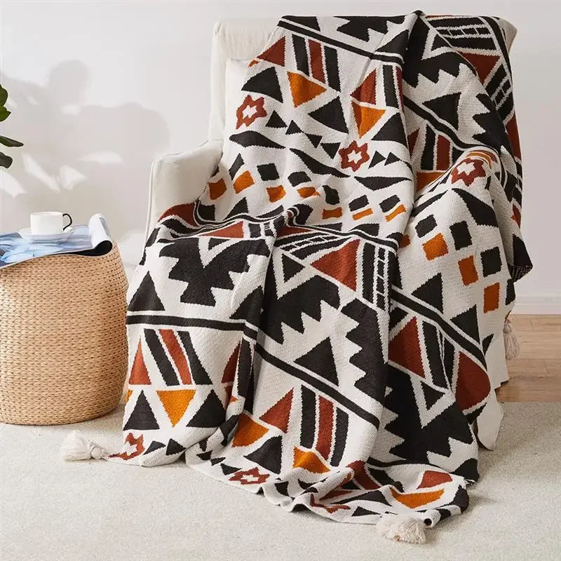 plaid tricoté bohème à pompons motif géométrique doux